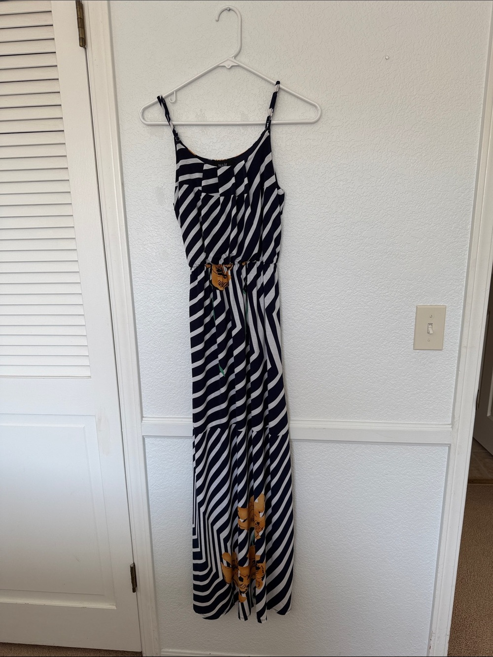 NAIF Black and White Striped Maxi Dress with Orange Floral Details